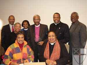 [Seated in front (l to r)...]
