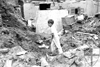 [thumbnail: A boy digging alone in th...]